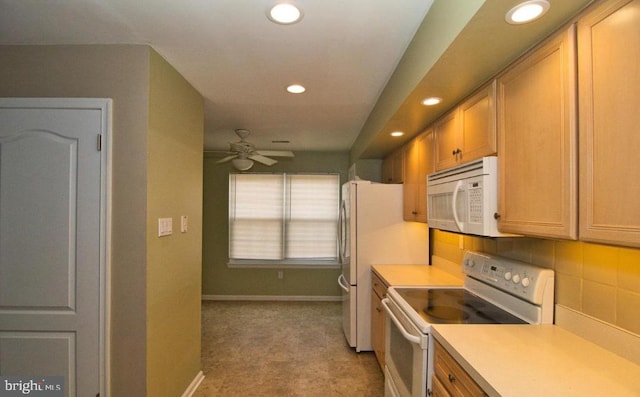 kitchen with recessed lighting, light countertops, decorative backsplash, white appliances, and baseboards