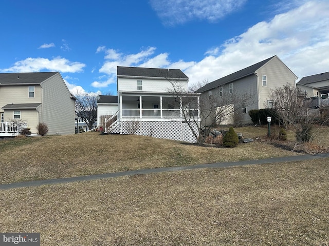 view of front facade with covered porch and a front yard