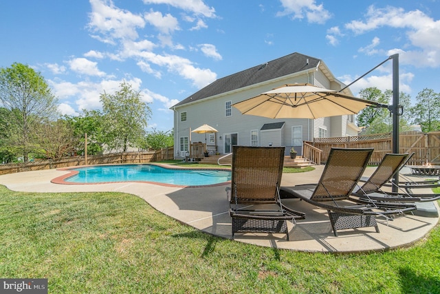 view of pool with a patio, a fenced backyard, a yard, and a fenced in pool