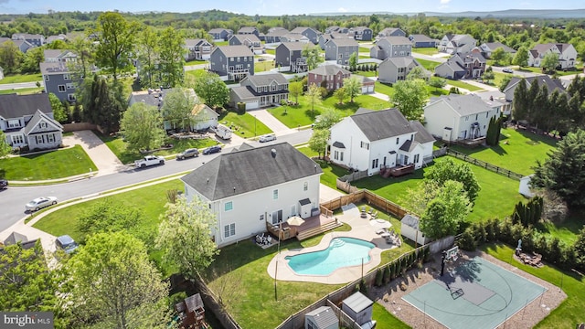 birds eye view of property with a residential view