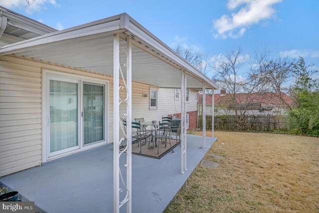 view of patio featuring fence