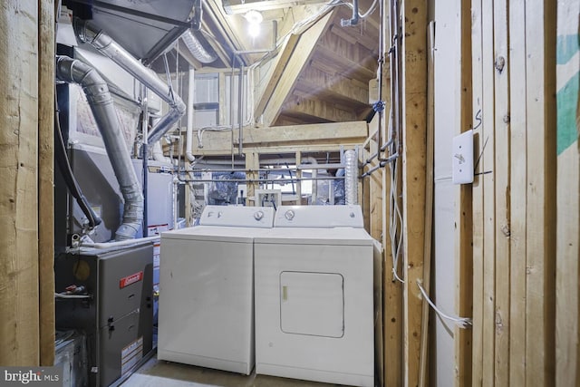 clothes washing area featuring laundry area and washing machine and clothes dryer