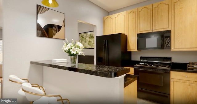 kitchen with dark countertops, black appliances, and light brown cabinets