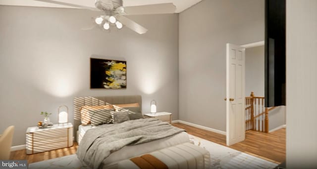 bedroom with a ceiling fan, baseboards, and wood finished floors