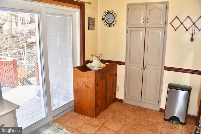 entryway with a healthy amount of sunlight and baseboards