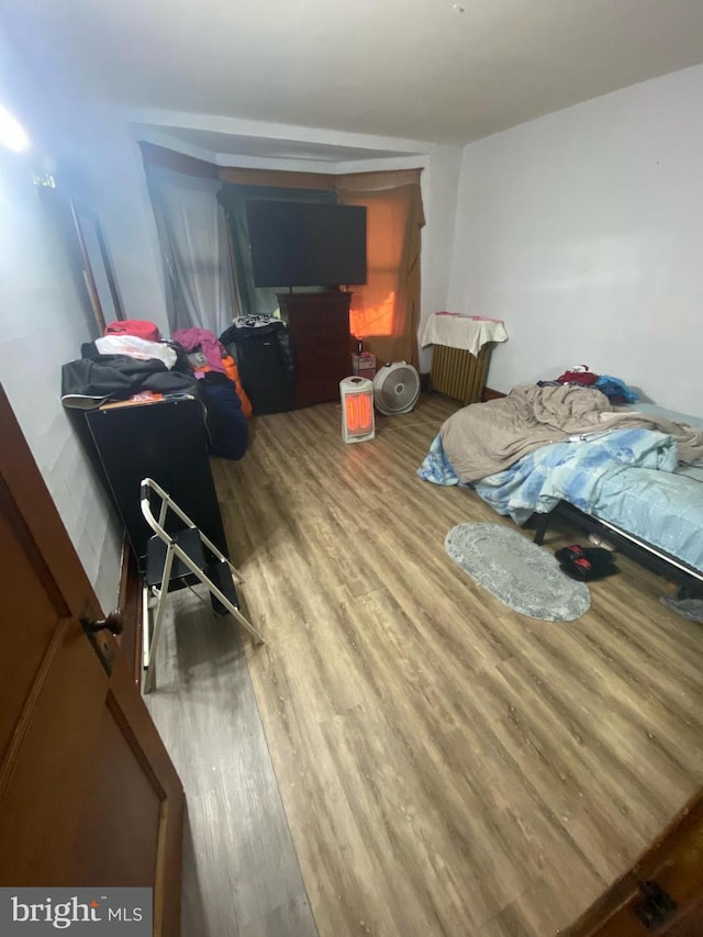 bedroom featuring wood finished floors