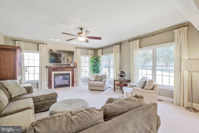 living area featuring light carpet and plenty of natural light