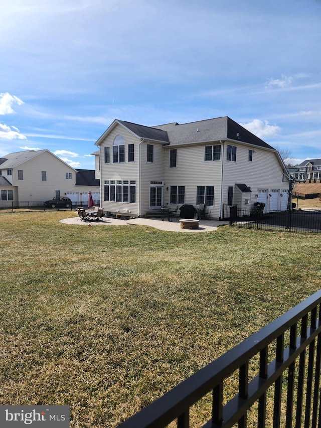 back of house with a patio area, an outdoor fire pit, a garage, and fence