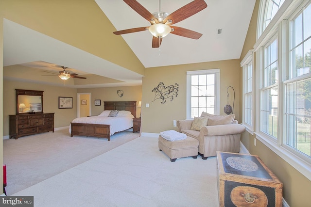 bedroom featuring baseboards, carpet, and high vaulted ceiling