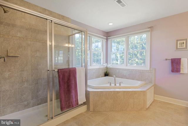 full bath with tile patterned flooring, visible vents, baseboards, a garden tub, and a stall shower