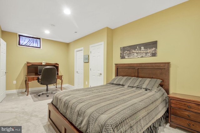 bedroom with recessed lighting, baseboards, and light carpet