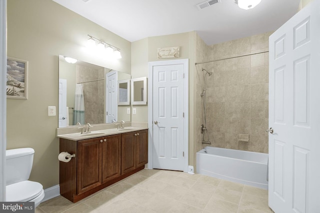 full bathroom with a sink, visible vents, shower / bathtub combination with curtain, and toilet