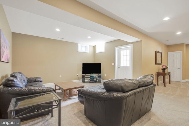 living area featuring recessed lighting, baseboards, and light carpet