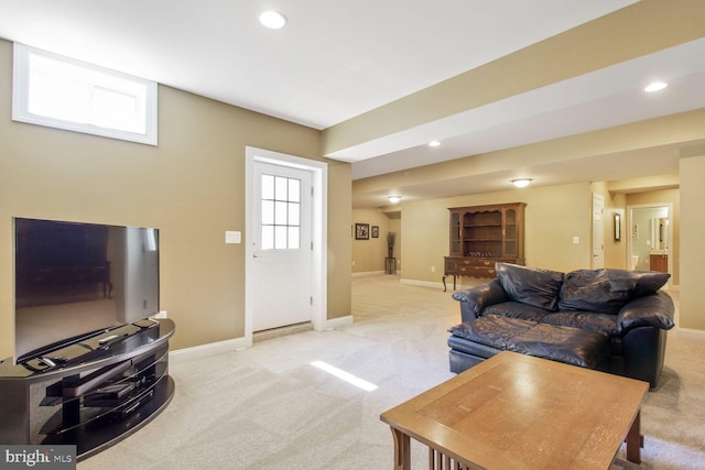 living room featuring recessed lighting, baseboards, and light colored carpet