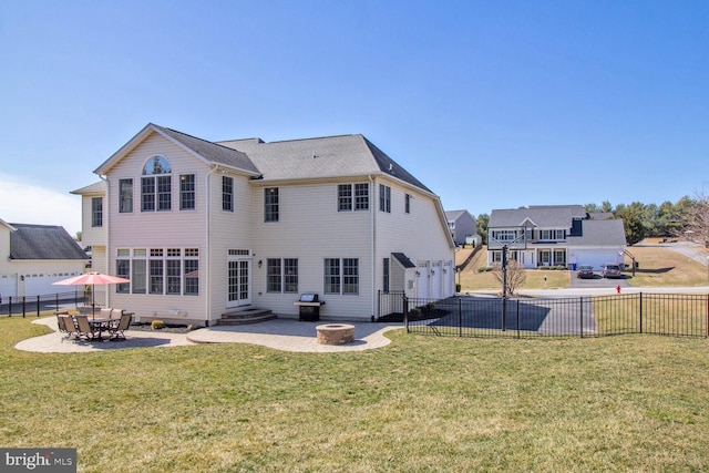 rear view of house with a patio area, a yard, and entry steps