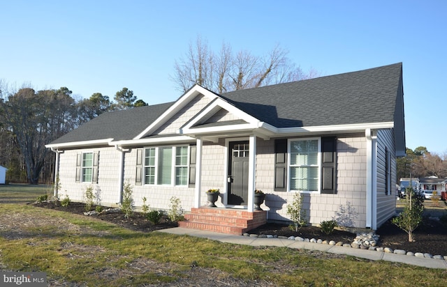 view of front of property featuring roof with shingles