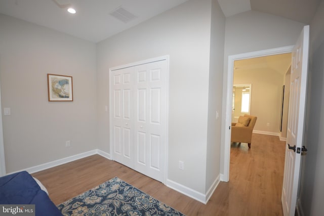 interior space featuring visible vents, baseboards, and wood finished floors