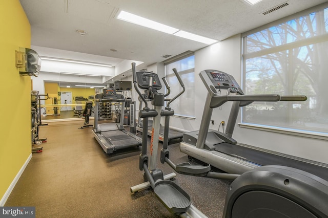 gym with visible vents and baseboards