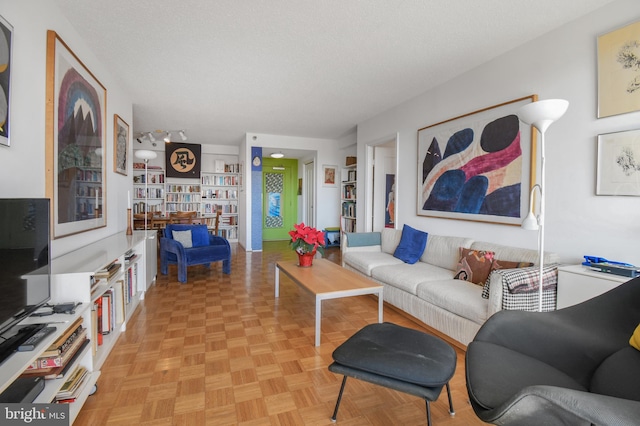 living room featuring a textured ceiling