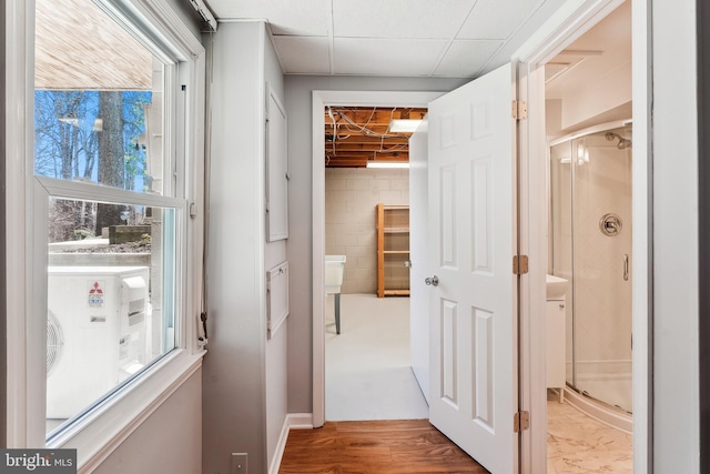 corridor with concrete block wall