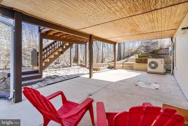 view of patio / terrace with ac unit and stairway