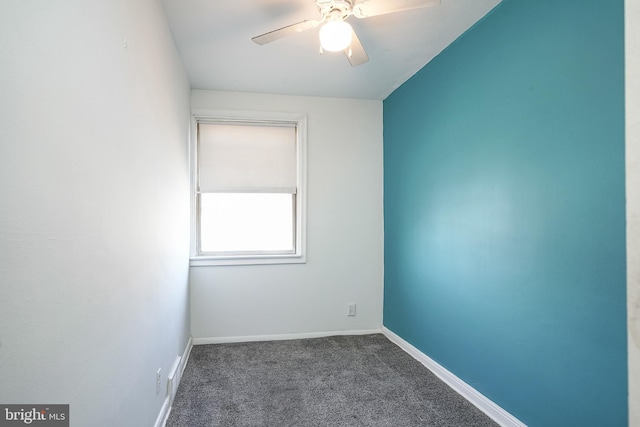 empty room with a ceiling fan, carpet flooring, and baseboards