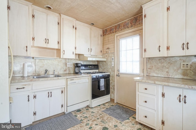 kitchen with under cabinet range hood, a sink, light countertops, dishwasher, and range with gas cooktop