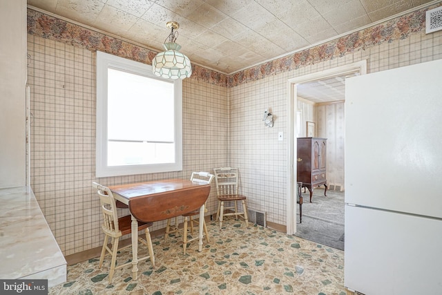 dining room featuring visible vents