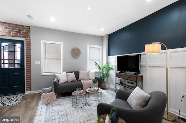 living room with wood finished floors and recessed lighting