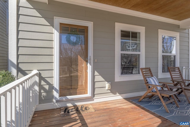 view of exterior entry with covered porch