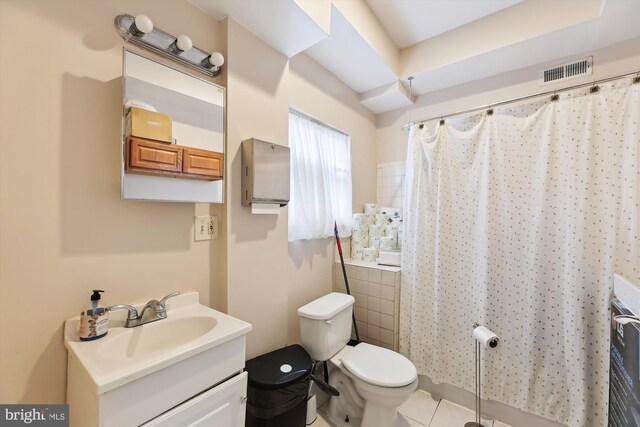 full bathroom with visible vents, toilet, tile patterned flooring, and vanity