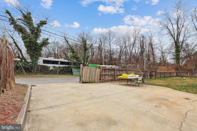 view of patio featuring fence