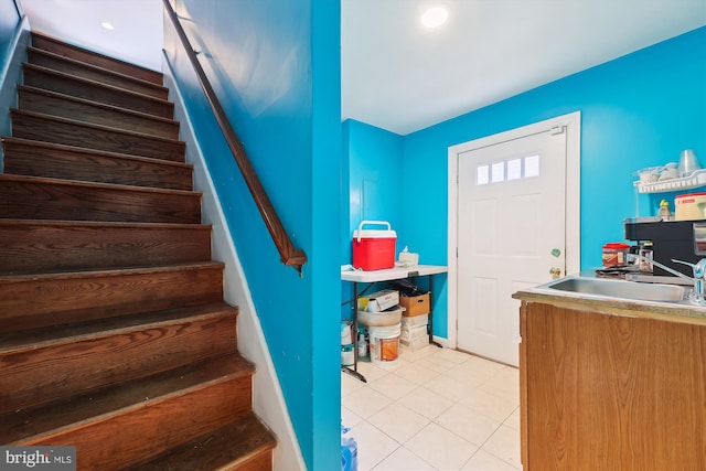 staircase with tile patterned floors