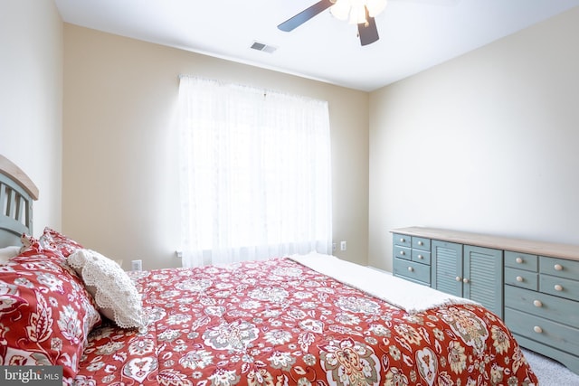 bedroom featuring carpet, visible vents, and ceiling fan