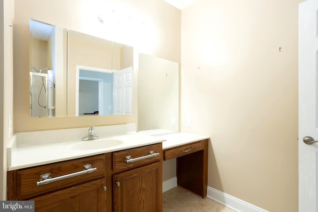 bathroom with tile patterned flooring, vanity, and baseboards