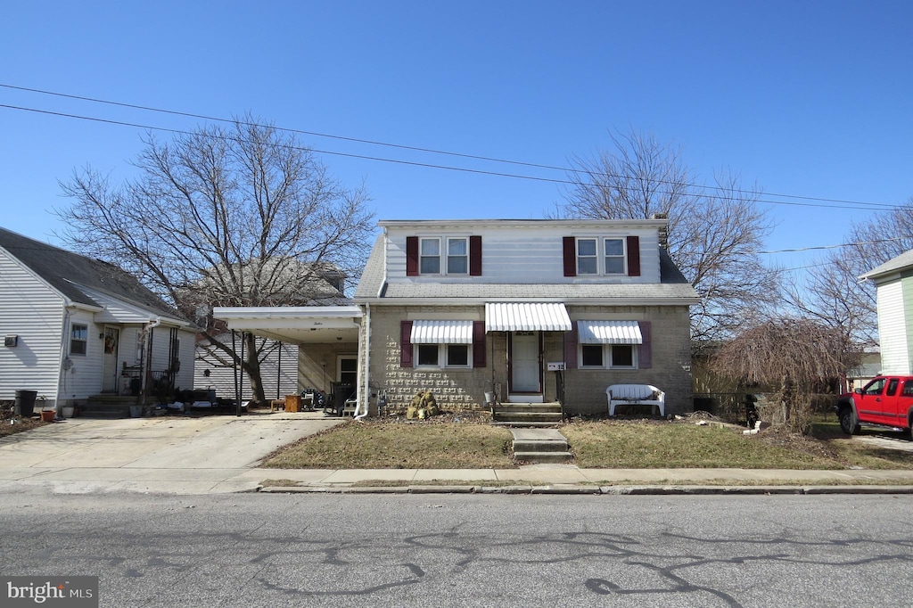 12 Commerce St, Hanover, PA 17331 - view of front of house with a carport and concrete driveway
