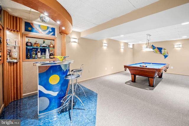 playroom featuring a paneled ceiling, billiards, carpet flooring, baseboards, and a bar