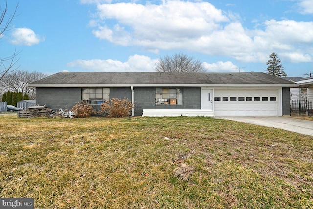 ranch-style home with a front lawn, concrete driveway, and a garage