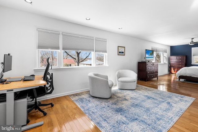 bedroom featuring baseboards, hardwood / wood-style flooring, and recessed lighting