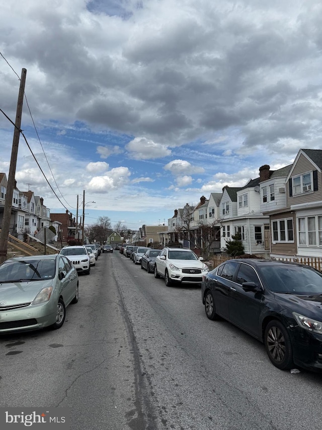 view of street with street lights and a residential view