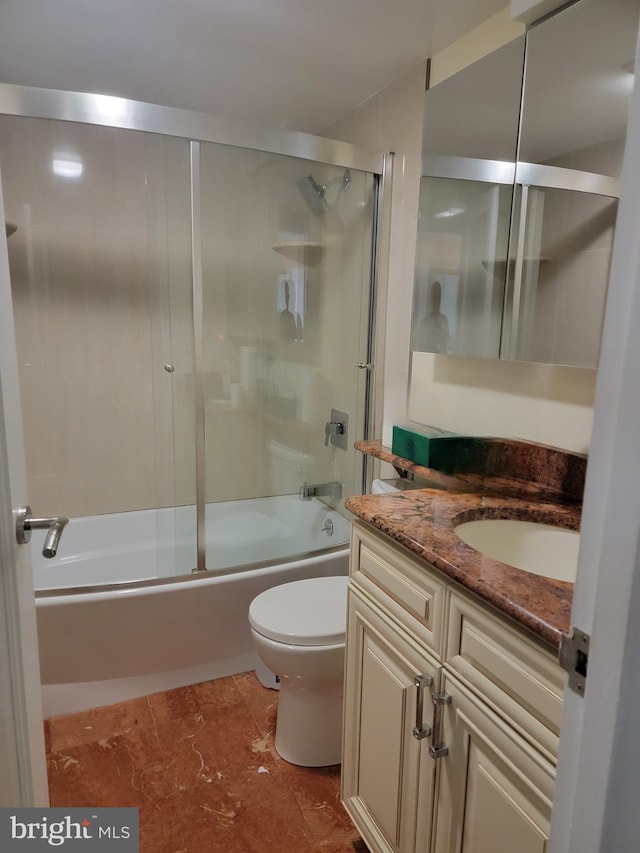 bathroom featuring shower / bath combination with glass door, vanity, and toilet