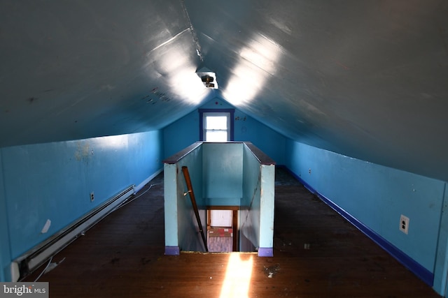 bonus room featuring baseboard heating, vaulted ceiling, and wood finished floors