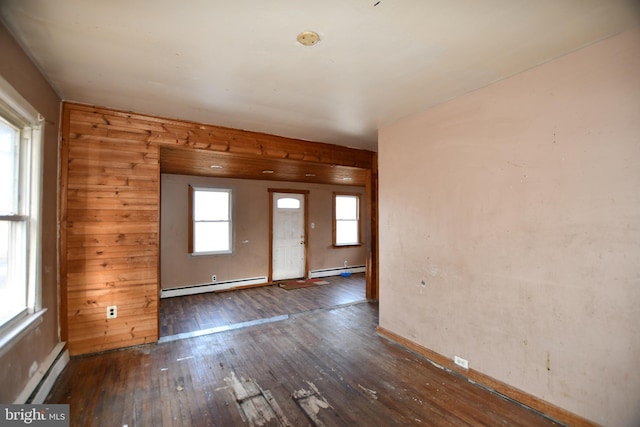 entrance foyer with a baseboard heating unit and hardwood / wood-style flooring