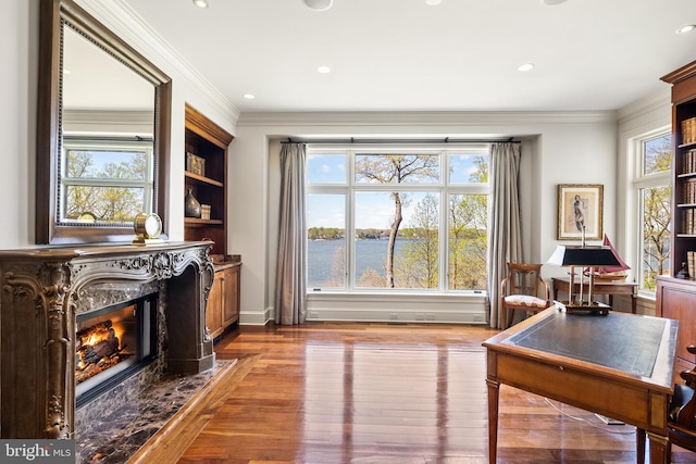 1900 Carrollton Rd, Annapolis, MD 21409 - interior space featuring crown molding, a healthy amount of sunlight, a high end fireplace, and hardwood / wood-style floors