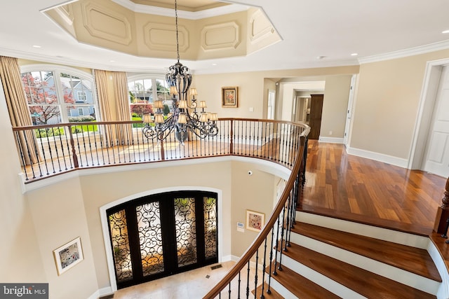 1900 Carrollton Rd, Annapolis, MD 21409 - foyer with an inviting chandelier, arched walkways, recessed lighting, baseboards, and wood finished floors