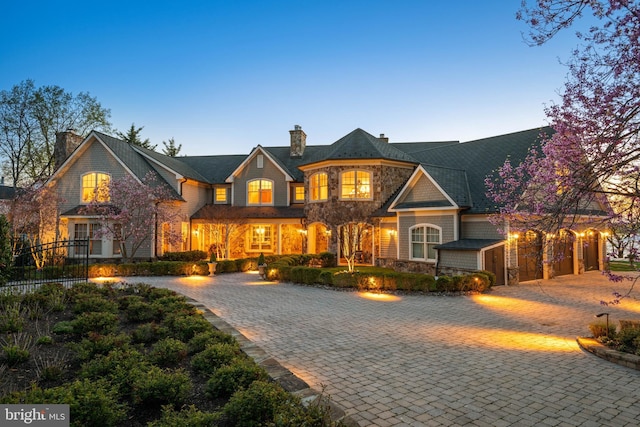 1900 Carrollton Rd, Annapolis, MD 21409 - view of front facade featuring curved driveway, fence, a chimney, and stone siding