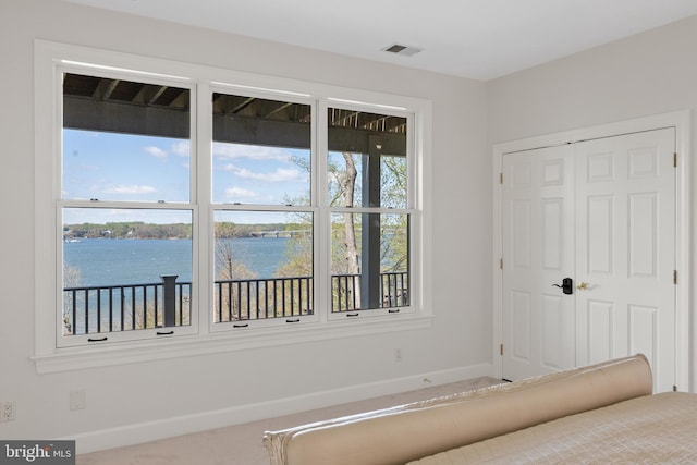 1900 Carrollton Rd, Annapolis, MD 21409 - unfurnished bedroom with a water view, baseboards, visible vents, and a closet