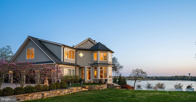 1900 Carrollton Rd, Annapolis, MD 21409 - view of front of house with a lawn and a water view