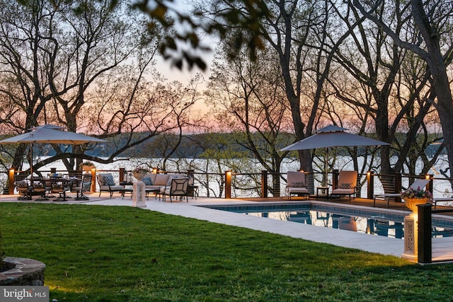 1900 Carrollton Rd, Annapolis, MD 21409 - pool at dusk with a fenced in pool and a lawn
