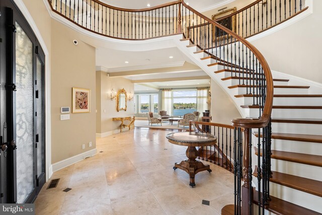 1900 Carrollton Rd, Annapolis, MD 21409 - tiled foyer with crown molding, baseboards, a high ceiling, and visible vents